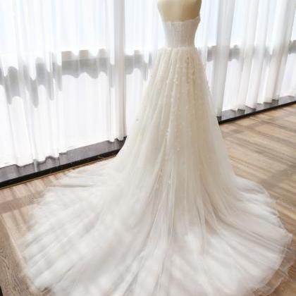 Tulle Wedding Gown Featuring Crystal Flower..