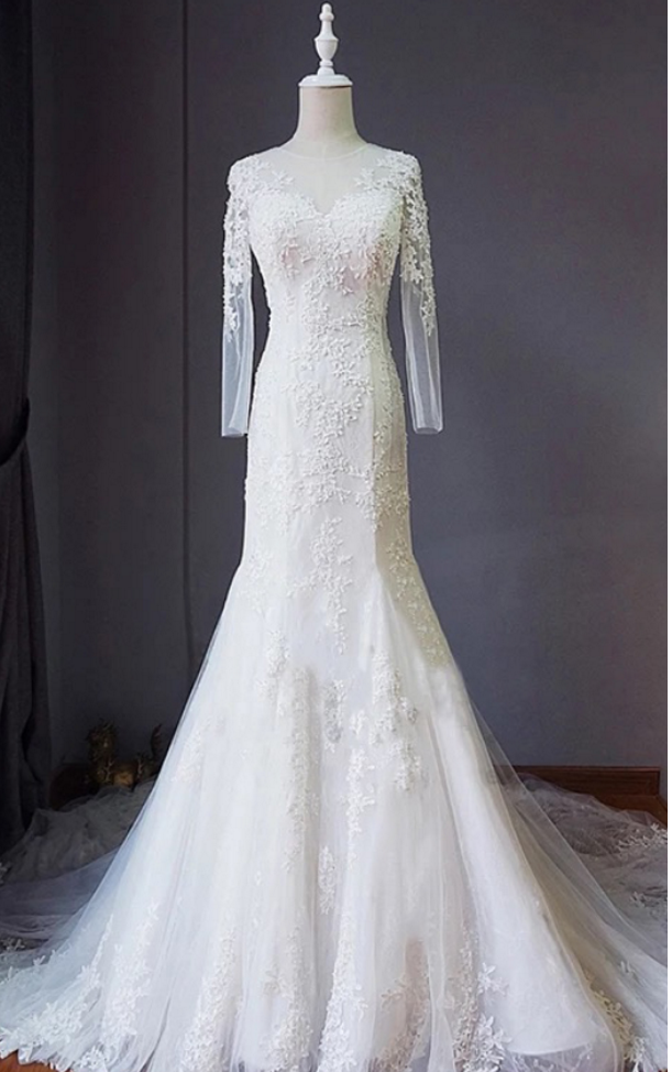 Long Sleeve Mermaid Wedding Dress Featuring Lace Appliqués And Lace-up Back